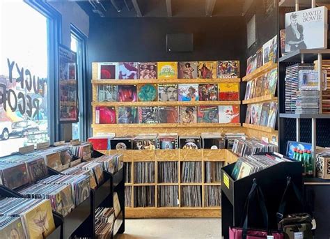 The interior of a record store with shelves filled with vinyl records