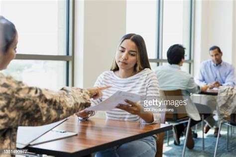 A recruiter speaking with a potential enlistee