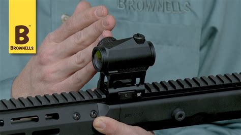 Red dot sight installation on an AR-15 rifle