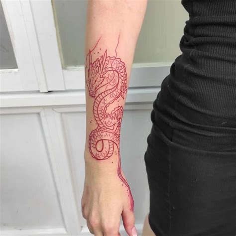 Red dragon forearm tattoo