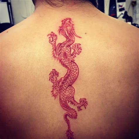 Different styles of red dragon tattoos