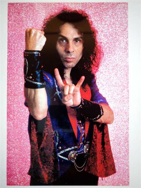 Ronnie James Dio throwing the horns