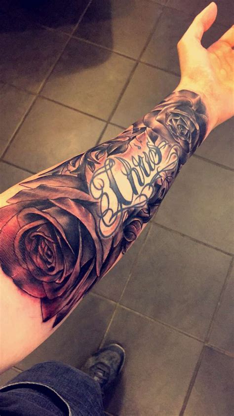 Rose back forearm tattoo