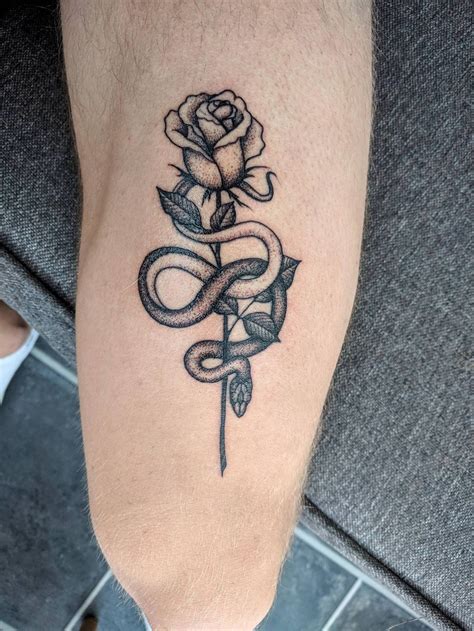 Rose tattoo with snake design