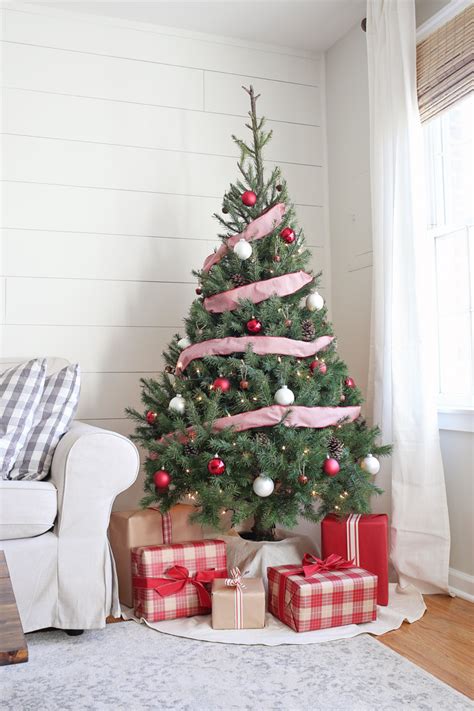 Rustic red and white Christmas tree decorated with burlap and ribbons