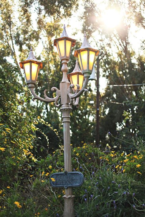 Rustic street lamp display with pinecones and twigs