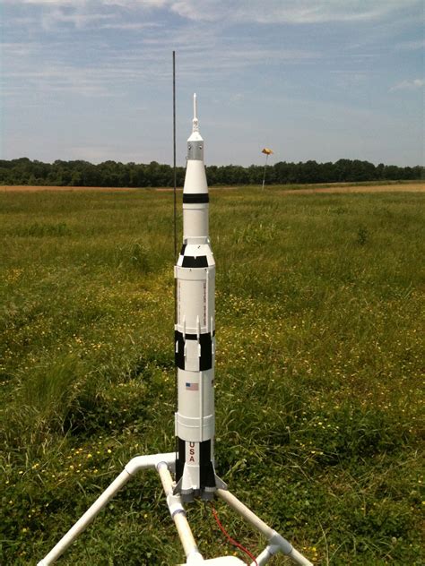 Saturn V model with other models