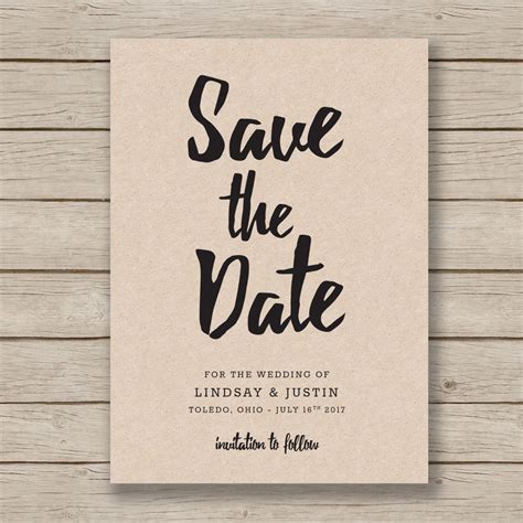 Couple holding a save the date card