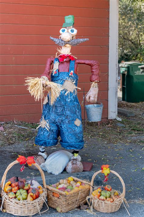 Scarecrow with a rake