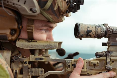 Scout Sniper providing overwatch in a urban environment