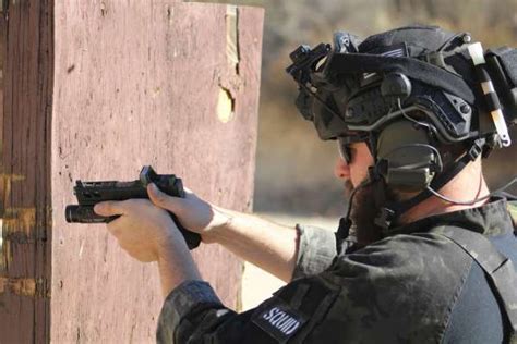 Navy SEALs training with handguns