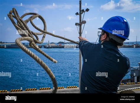 Seamen operating a crane