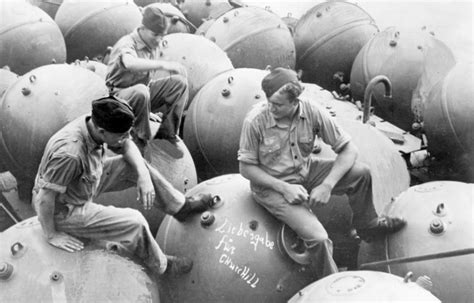 A photograph of a sea mine being deployed, circa World War II