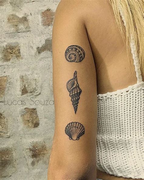 Seashell and driftwood tattoo