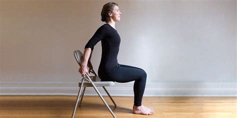 Senior performing seated chest stretch