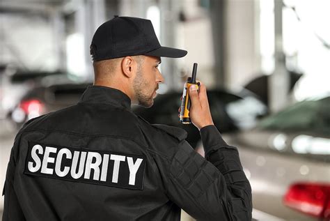 Security Guard Monitoring CCTV Cameras