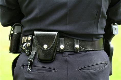 A security guard using a communication device