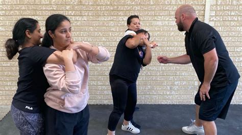 A person practicing self-defense techniques at a shooting range