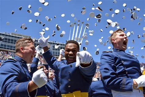 Graduates of a service academy celebrating their achievement