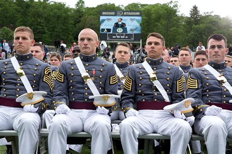 Graduates of a service academy celebrating their achievement