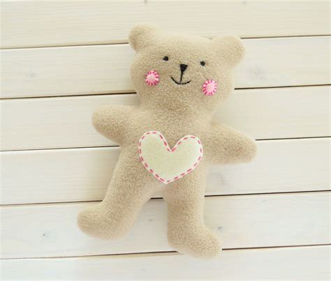 Sewing teddy bear body and head pieces together