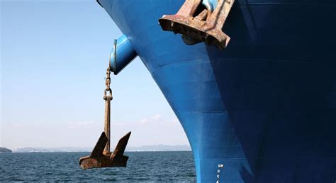 A large ship anchor being lifted