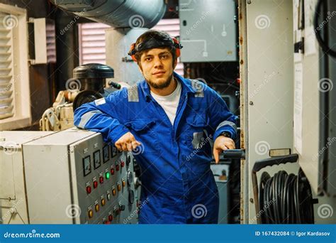 Ship Engineer Inspecting Equipment