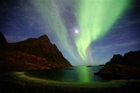 A shooting star with the aurora borealis