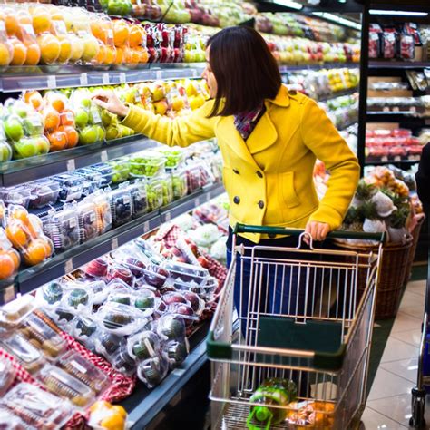 Image of a person shopping for produce.