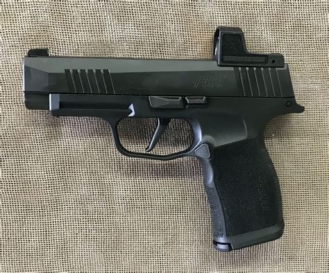 Sig Sauer P365XL in Background