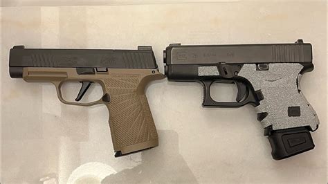 Sig Sauer and Glock handguns side by side