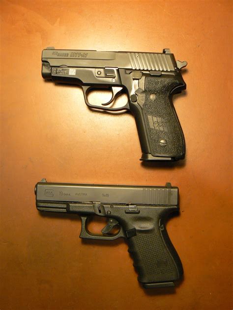 Sig Sauer and Glock pistols side by side