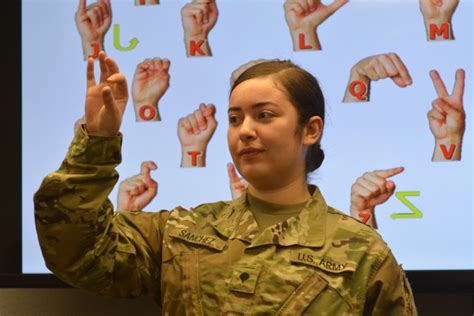 Military personnel using sign language in the field