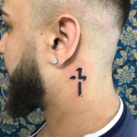 Simple cross tattoos for behind ear