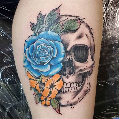 Skull and flower tattoo