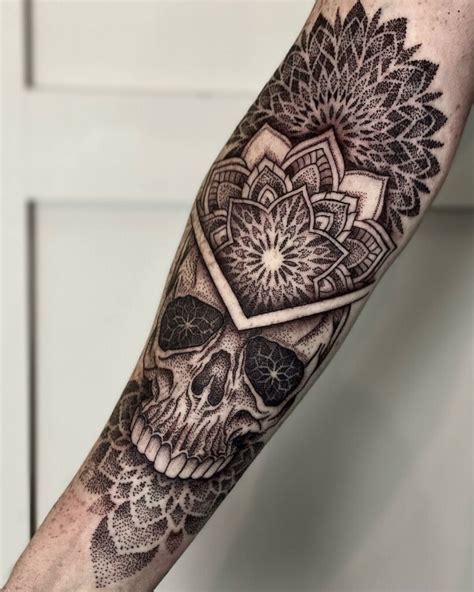 Skull back forearm tattoo