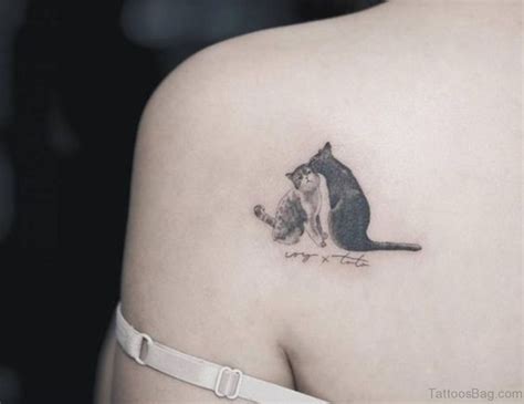 Small cat tattoos on shoulder