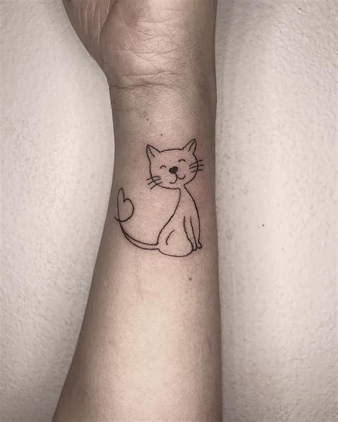 Small cat tattoos on wrist