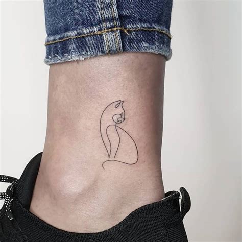 Small cat tattoos with line work