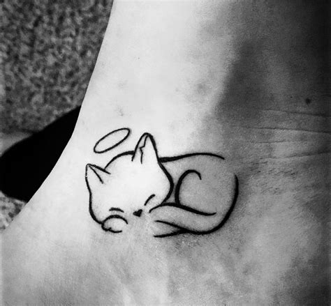 Small cat tattoos with symbols