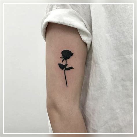 Small rose black tattoo idea