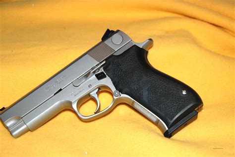 Smith & Wesson 1076 with stainless steel frame and slide.