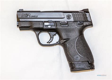 A Smith & Wesson M&P Shield semiautomatic pistol on display in a museum