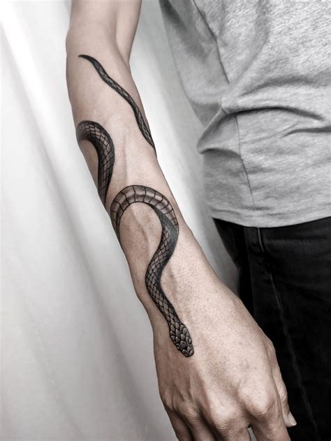 Snake bicep tattoos