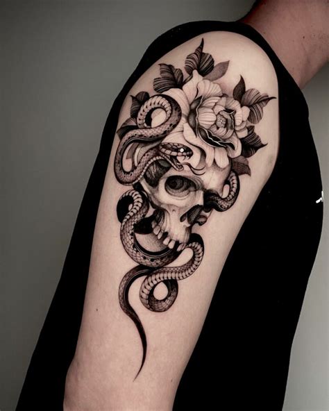 Snake tattoos with flowers for a symbolic design