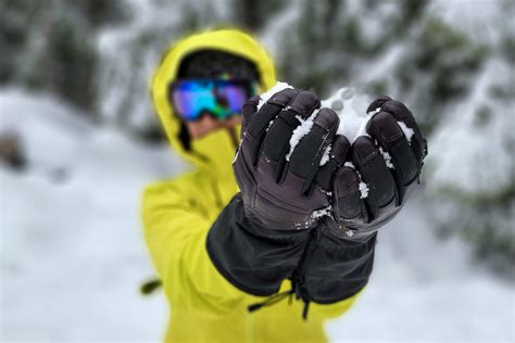 A mitten coloring page featuring snowy mittens