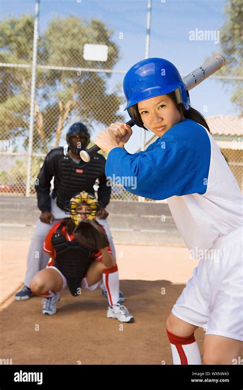 Softball player batting