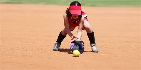 Softball player fielding