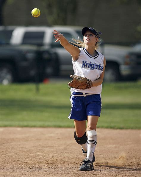 Softball player throwing