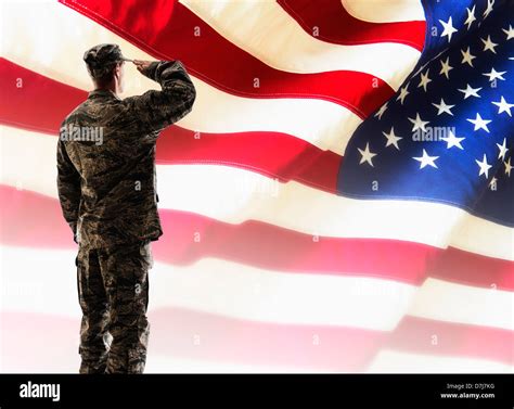 Soldiers with the American flag during a ceremony